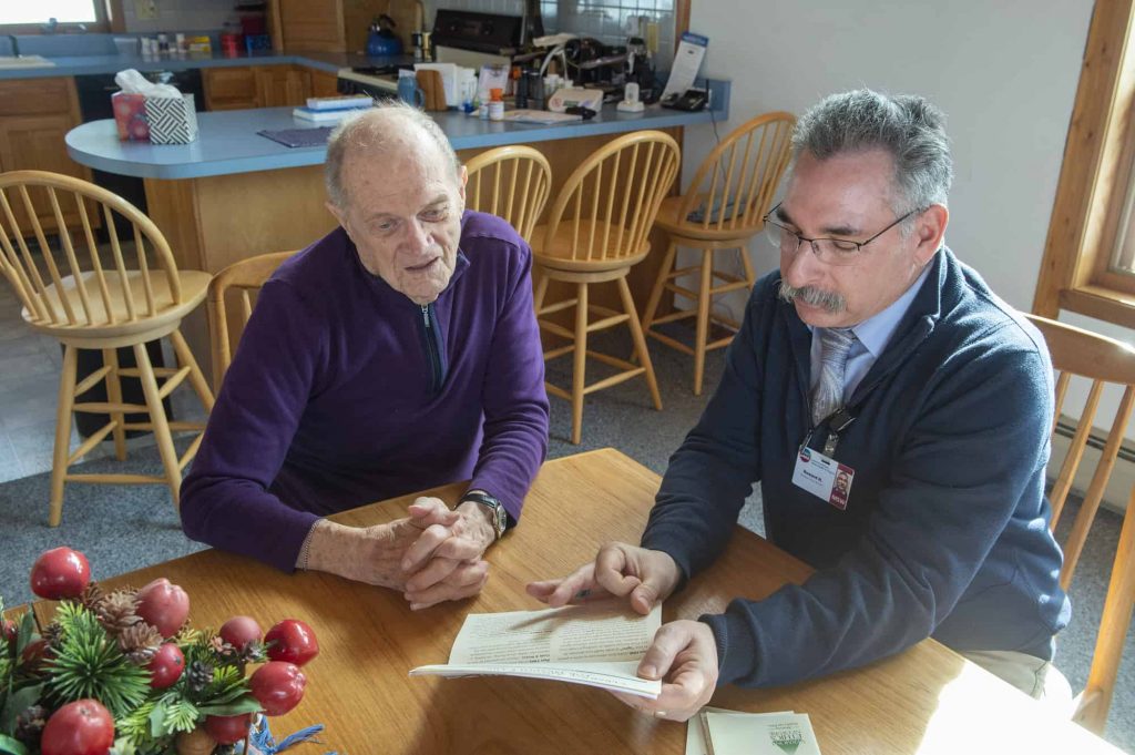 Howard Hoffman, CVHHH social worker, working with client at home Adult Home Care services