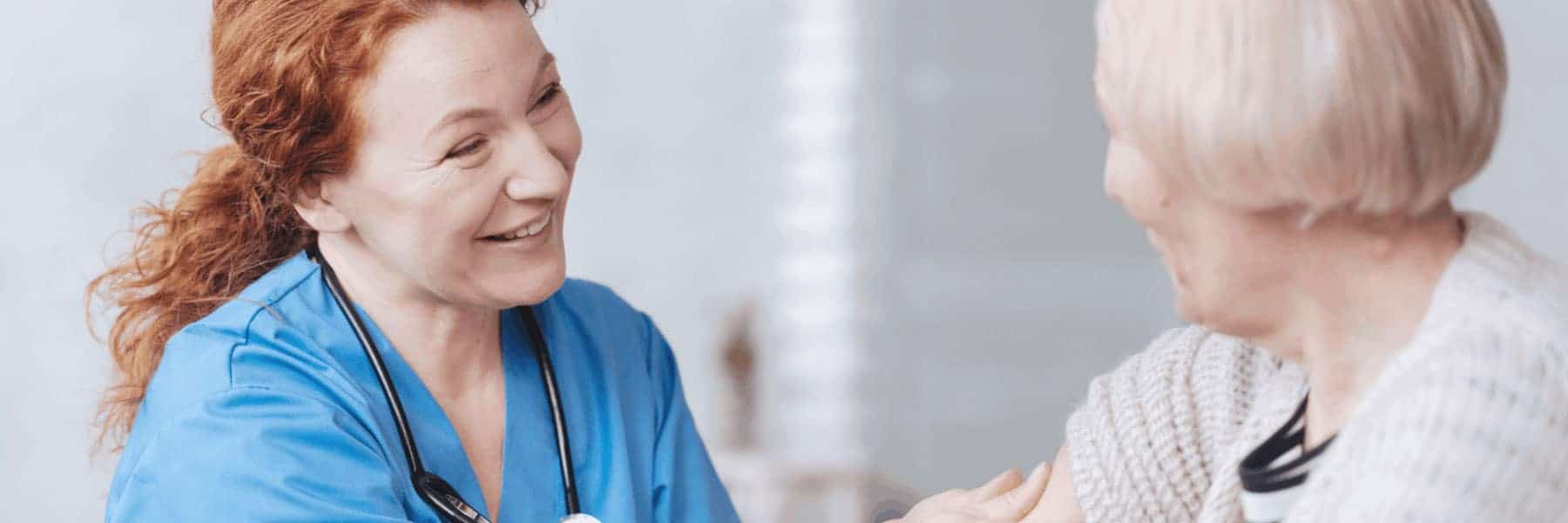 nurse and patient taking blood pressure