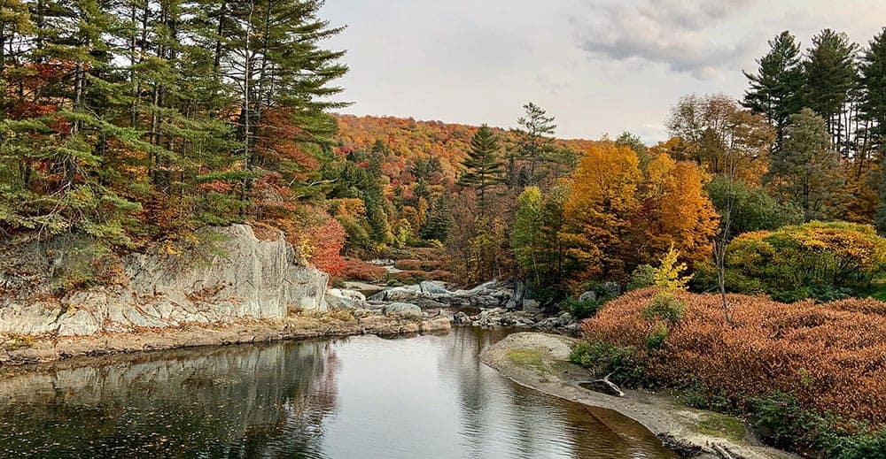 Vermont river in fall, by John Holm