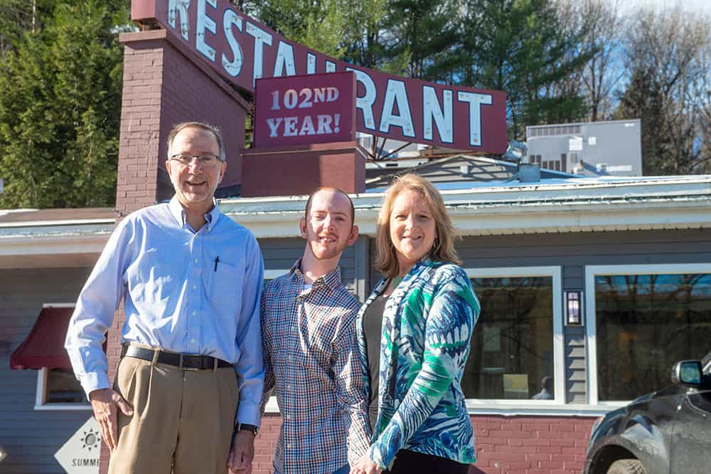 The Zecchinelli family poses outside of their restaurant, Wayside, in Barre. They are CVHHH clients.