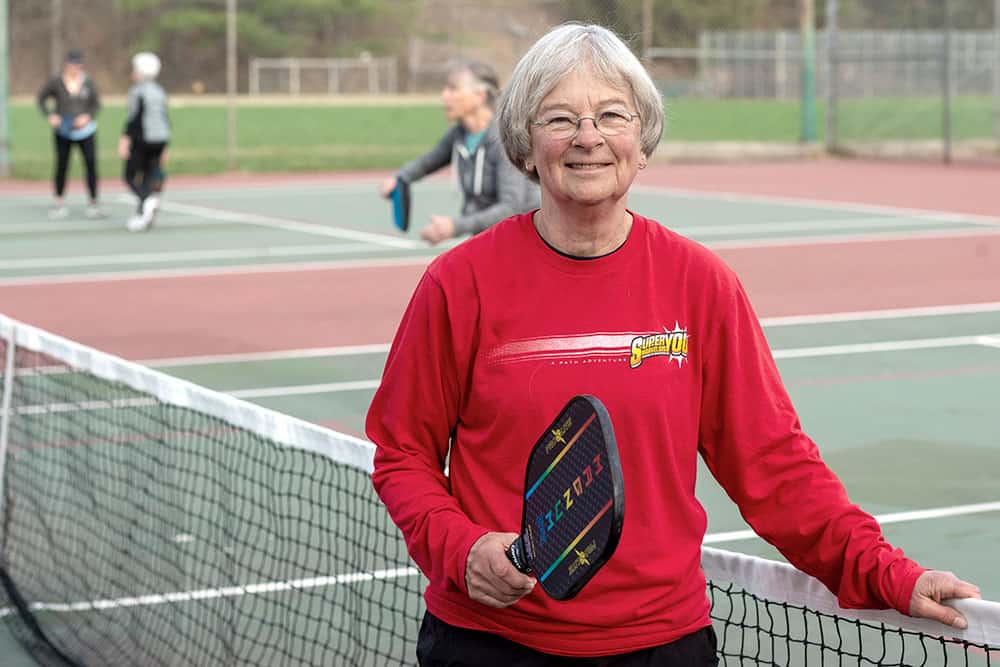 Janey Malloy is playing tennis. She is a CVHHH hospice volunteer.