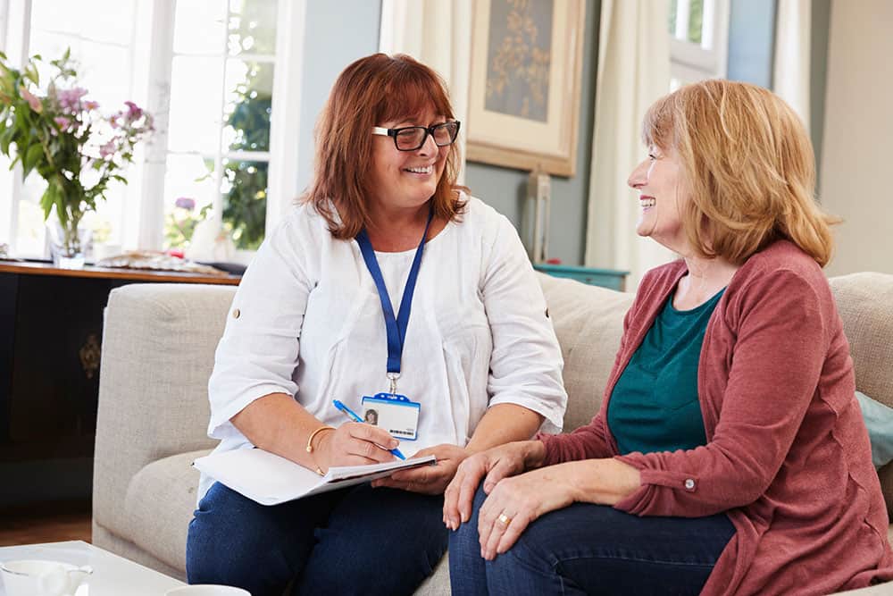 CVHHH social worker sitting with client at home