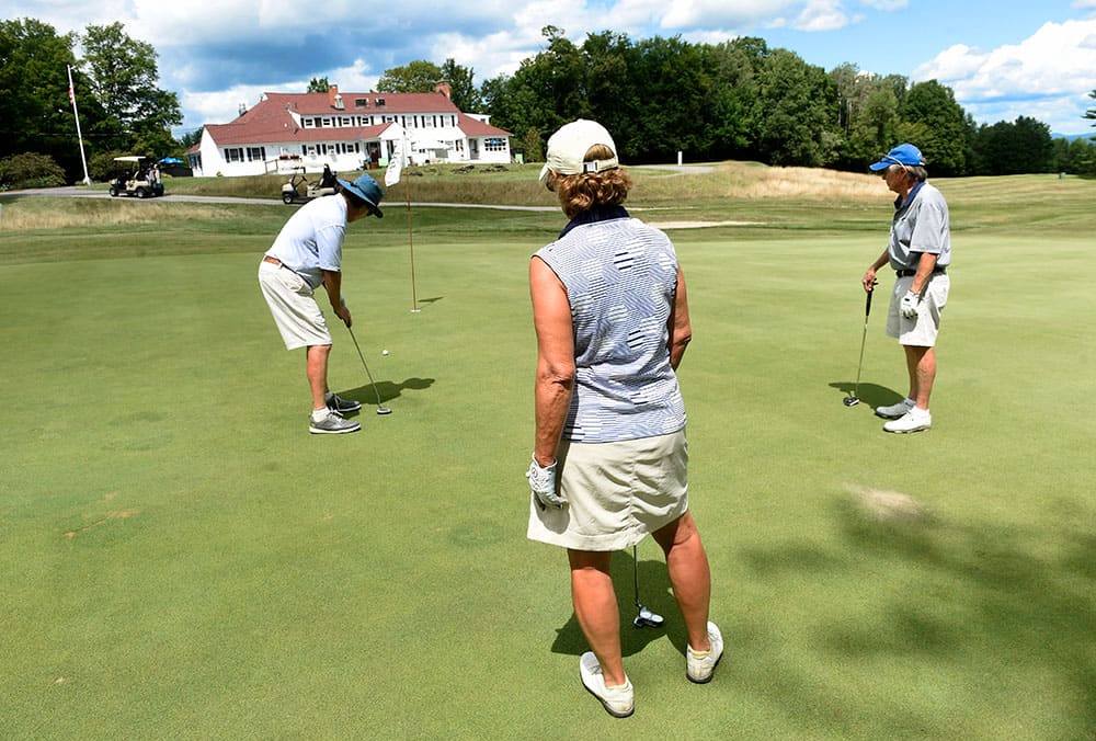 Photos of a team playing in the 25th Annual Hospice Memorial Golf Tournament