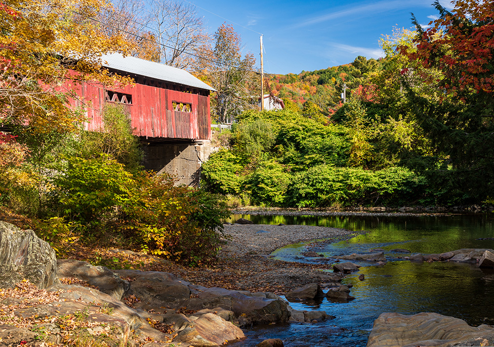 A scenic photo of a covered bridge in Vermont